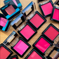 Romantic Flower Blush For Girls open compact cases showing vibrant pink, fuchsia and coral powder shades