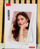 KBroad Mirror Wireless Speaker (Model: KTS-2221), a tabletop makeup vanity mirror featuring built-in LED front lighting and an integrated wireless Bluetooth speaker