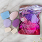 Sweet Beauty Power Pocket Puff dual sided powder puff pack of 7 makeup sponges in assorted shapes and colors on marble surface